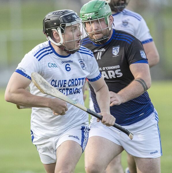 Dungarvan's Darragh Lyons in possession against Fourmilewater's Dylan Guiry. 