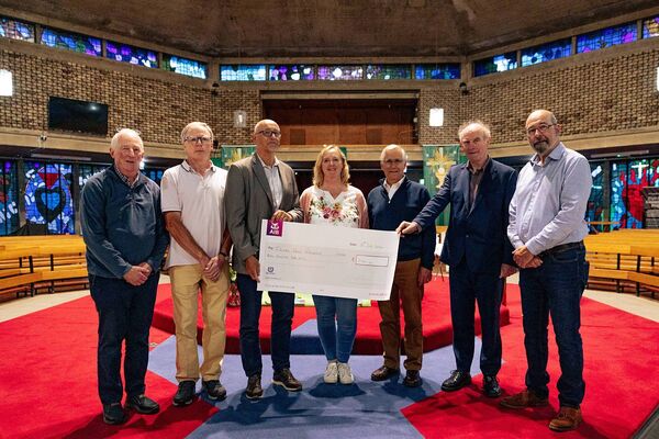 A cheque for €7,000 being presented to representatives of the Ishiara Parish Partnership