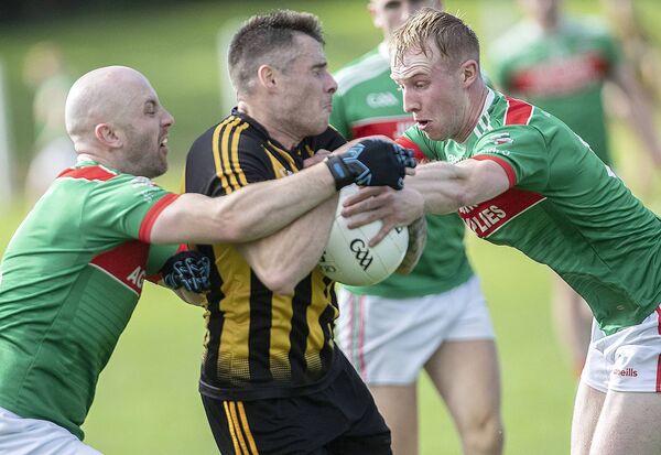 Brickey Rangers Mark Cummins is tackled by Rathgormack's Conor Walsh and Sean Hahessy. Brickey Rangers Mark Cummins is tackled by Rathgormack's Conor Walsh and Sean Hahessy.