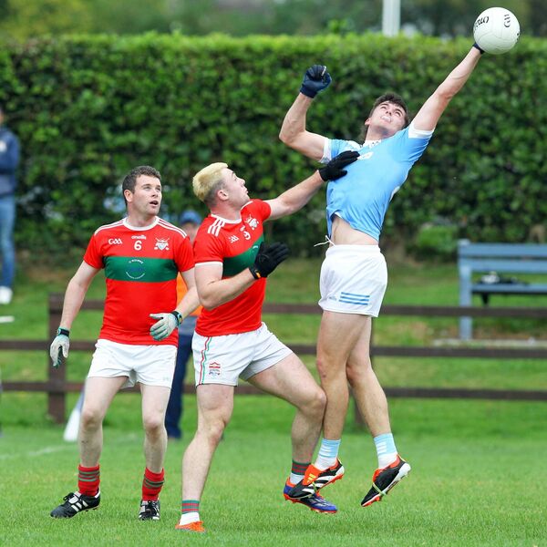 Roanmores Rory Furlong tries to control a high ball Photo: Eddie Dee