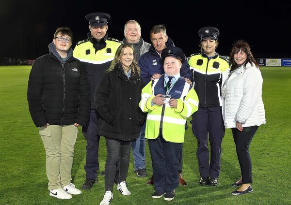 Aidan Phelan who was introduced to the crowd at the RSC at half time as the newest Little Blue Hero is pictured with Colin Power, Head of Community, Waterford FC, Sgt.Gavin Sheahan, Garda Rebecca Fogarty, Garda Lisa Mullins, Aidan's parents Amanda and James Phelan and his brother Conor Phelan.