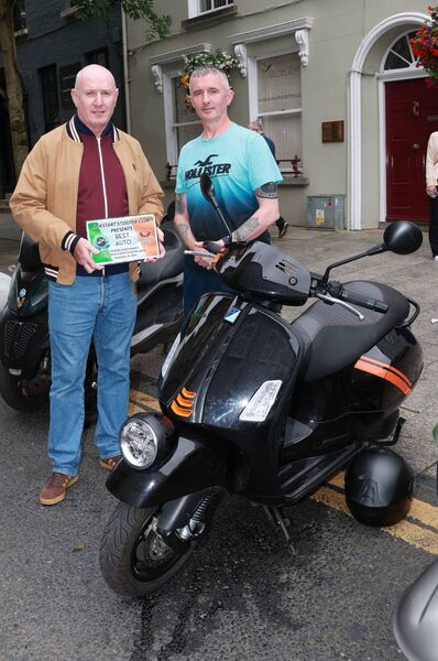 Damien Nolan presented the Best Auto award to Martin Bradshaw, at the Phoenix Yard Market/Kickstart Scooter Club, Custom and Classic Scooter Show. Photo: Joe Evans