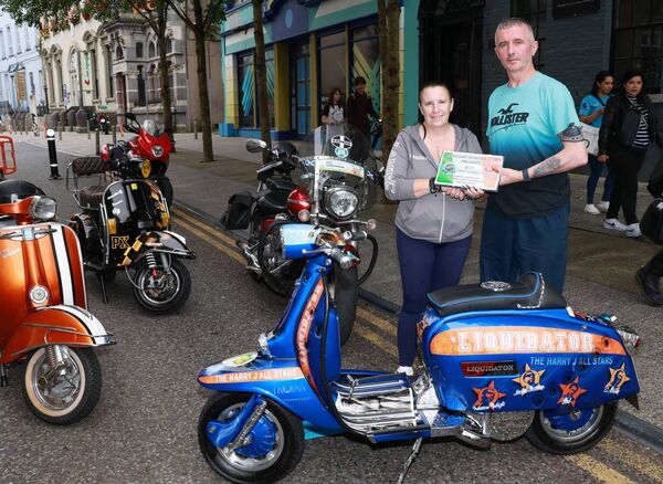 Damien Nolan presented the Best Paint/Mural award to Margaret Leigh, at the Phoenix Yard Market/Kickstart Scooter Club, Custom and Classic Scooter Show. Photo: Joe Evans