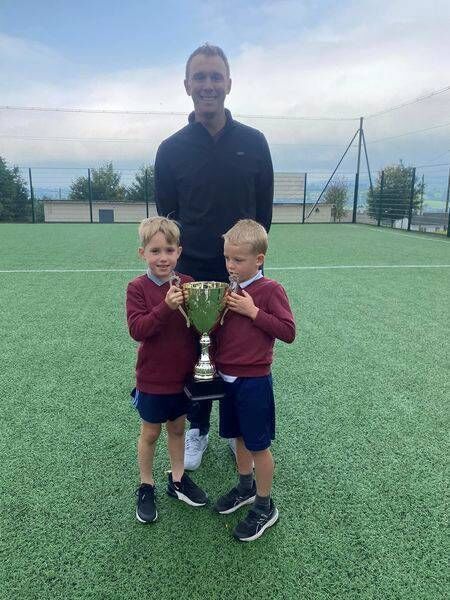 Past pupil Seamus Power with two of the pupils from Touraneena National School