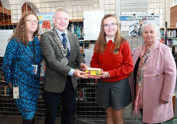 Mayor of Waterford City &amp; County Cllr Jason Murphy presented Emma of St Angela's Secondary with her award, with Sinead Cummins, Librarian and Ann Nolan, Waterford Integration Services.