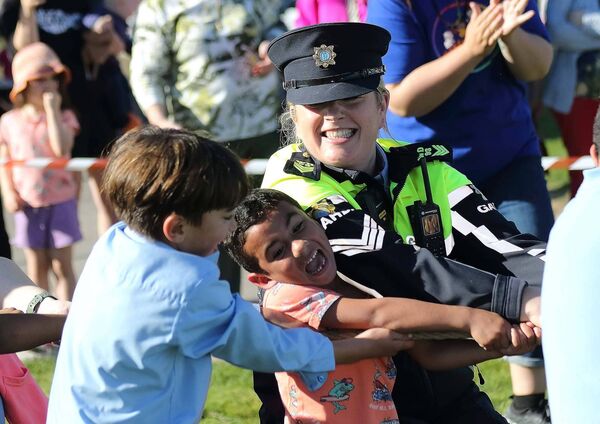 Sgt. Maureen Neary giving her all during the Tug of War at Playful Streets on Ballybricken Green.
