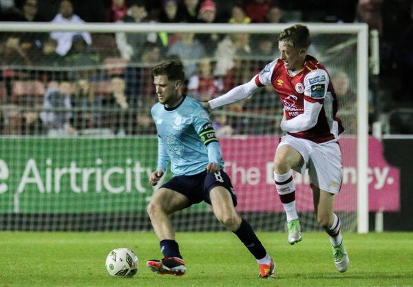 Waterford's Barry Baggley tries to fend off the challenge of St. Pat's midfielder Chris Forrester. Photo: INPHO/Dan Clohessy