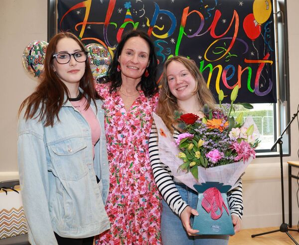 Past students Kristine and Rebecca presented flowers to Ms Kenneally.