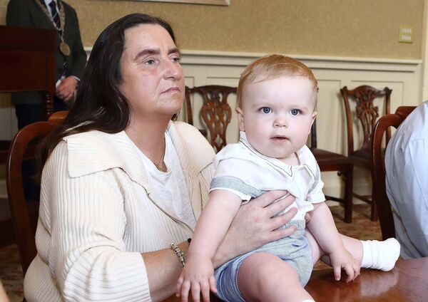 Damien's wife Jenny Barrett Vereker pictured with her grandson Archie.