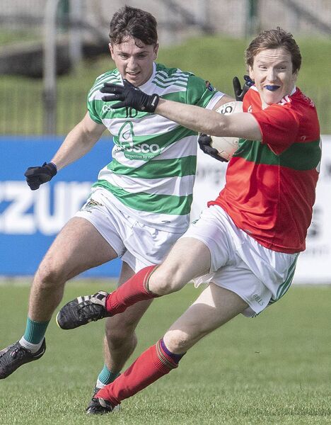 Clashmoire/Kinsalebeg's Aidan Trihy trys to get away from Ballinacourty's Dean Beresford. Clashmoire/Kinsalebeg's Aidan Trihy trys to get away from Ballinacourty's Dean Beresford.