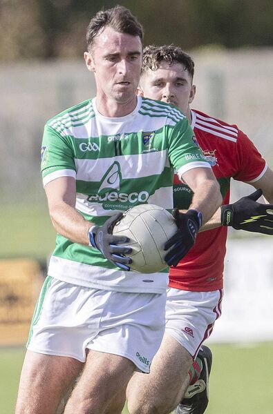 Ballinacourty's Michael O’Halloran with the ball ahead of Clashmoire/Kinsalebeg's James Moloney. Ballinacourty's Michael O’Halloran with the ball ahead of Clashmoire/Kinsalebeg's James Moloney.