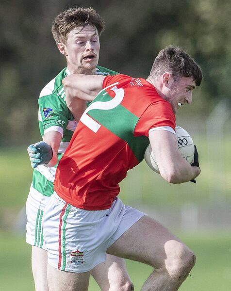 Clashmoire/Kinsalebeg's Josh Fitzgerald with the ball against Ballinacourty's Conor McCarthy. Clashmoire/Kinsalebeg's Josh Fitzgerald with the ball against Ballinacourty's Conor McCarthy.