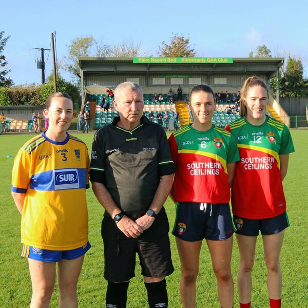 Team captains Taylor Healy (Erins Own) & Keeley Corbett Barry and Emma Murray (Comeragh Rangers) with match official Paddy Lawlor. Team captains Taylor Healy (Erins Own) & Keeley Corbett Barry and Emma Murray (Comeragh Rangers) with match official Paddy Lawlor.