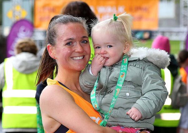 The Women's Solas Run winner Siobhan Heylin pictured with her daughter after the race
