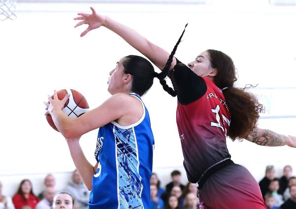 Wildcats Kate Hickey under pressure from Fr. Matthews Kyra White still manages to score.