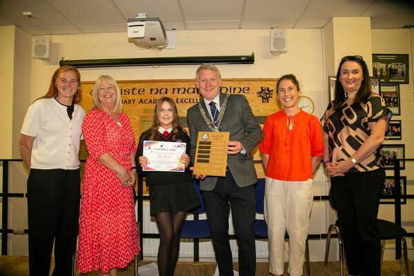 Ellie Moore receiving the Junior PE Award. From left: Beth Carton (PE teacher),Orla Bolger (Principal), Ellie Moore, Mayor Cllr Jason Murphy, Lauren Dermody (PE teacher), and Karen Coffey (Arachas) sponsors. Photo: John Power