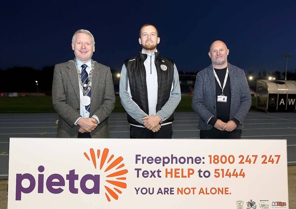 The Mayor of Waterford City &amp; County, Cllr.Jason Murphy and John Dempsey, National Community Funding &amp; Advocacy Team Lead Pieta are pictured with the Tycor FC representative Adam Sutton. 