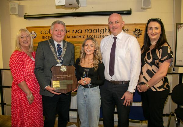 Ella Foley receiving Senior Business Award. From left to right: Orla Bolger (Principal), Mayor Cllr Jason Murphy, Ella Foley, Vivian Lonergan (Business teacher), and Karen Coffey (Arachas) Sponsers.