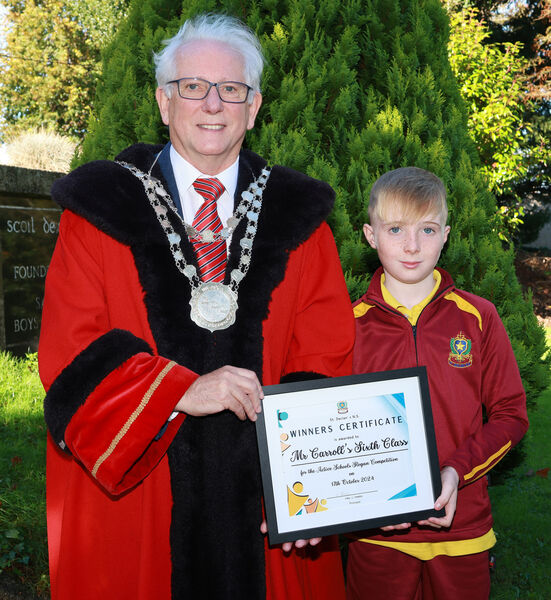 Metropolitan Mayor of Waterford Cllr Joe Kelly, visited St. Declan's NS and is pictured here with Ryam, representative for Mr Carroll's Sixth Class winners of the Active Schools Slogan Competition. Metropolitan Mayor of Waterford Cllr Joe Kelly, visited St. Declan's NS and is pictured here with Ryam, representative for Mr Carroll's Sixth Class winners of the Active Schools Slogan Competition.