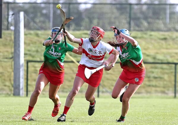 De La Salle's Beth Carton is determined to win possession in midfield.