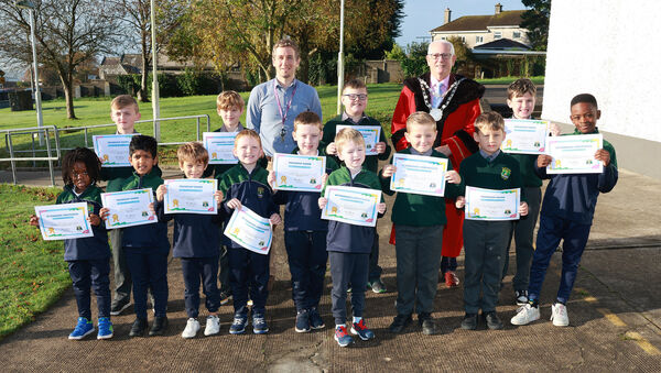  Metropolitan Mayor of Waterford Cllr Joe Kelly, visited St Marry's BNS Ferrybank on his annual school visits and is pictured here with pupils who received attendance certificates and Principal James Robinson. Photo: Joe Evans