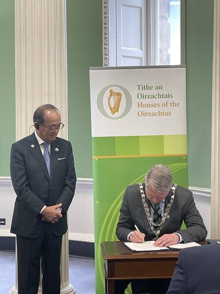 Mayor of Waterford City and County, Cllr. Jason Murphy signing the Mayors for Peace declaration and Mr. Kazumi Matsui, Mayor of Hiroshima.