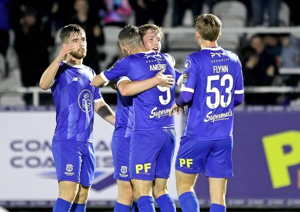 Waterford FC's Padraig Amond leads the celebrations with Sam Glenfield, Ryan Burke, and Shane Flynn, after Sam's goal gave the Blues a share of the points against Blues