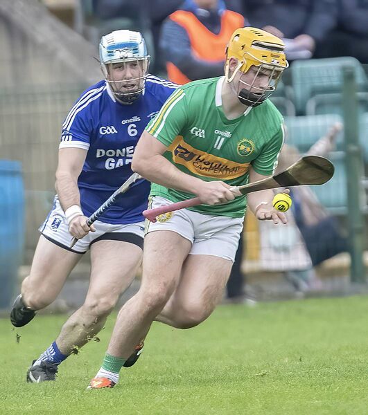 Kilrossanty's Alan Dunwoody gets away from Feenagh Kilmeedy's Bryan Hannigan.
