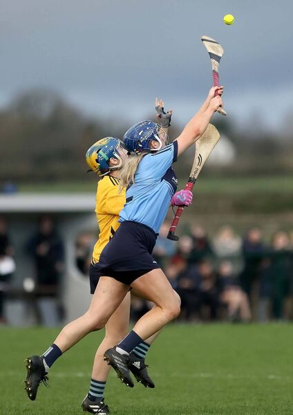 Gailltir's Anne Corcoran goes high to bat down Clonlara puck out.