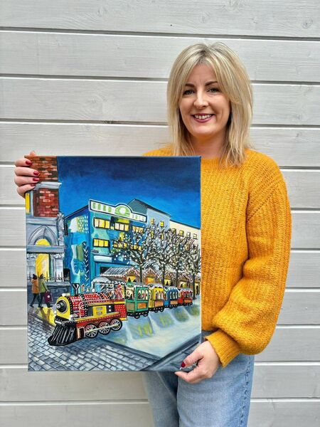 Artist Lisa Keane, with the original painting she created for the cover of Festive Star 2024.