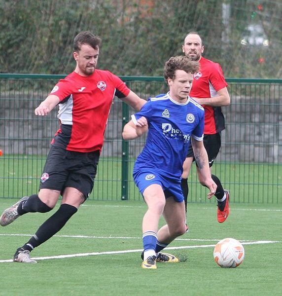 Waterford League defender Ben Daly takes the ball out of defence against The Cork Business League in the Oscar Traynor Trophy at Ben Wadding Park last Sunday.