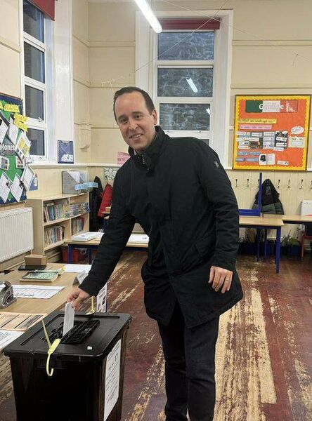 Fine Gael candidate John Cummins voting in his former 6th class classroom. Fine Gael candidate John Cummins voting in his former 6th class classroom.
