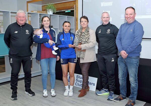 The Under 17 Girl's Player of the Year sponsored by Kate Toman and Heather Kiely was Issy Walsh and she is pictured receiving her award from sponsor Heather Kiely, also included were Kate Toman and her baby Páidí Gallagher, coach Trevor Casey, Owen Power, BSC and Academy Director Mike Geoghegan.