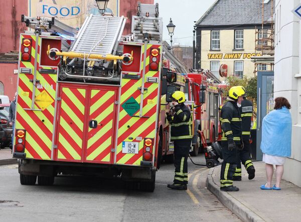 Fire Service evacuate guests at the Tower Hotel this morning as a precaution. Photo: Joe Evans