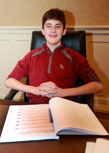  Billy feeling relaxed in the Mayor's chair, at City Hall where a reception was held for De La Salle College Hubstars. Photo: Joe Evans