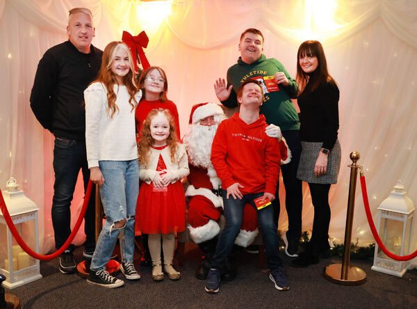  The Conway family with Santa, at the Down Syndrome Christmas Party in the Tower Hotel. Photo: Joe Evans