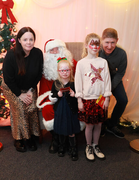  The Byrne family with Santa, at the Down Syndrome Christmas Party in the Tower Hotel. Photo: Joe Evans