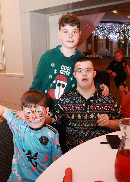  Reuben, Oscar and Conor, at the Down Syndrome Christmas Party in the Tower Hotel. Photo: Joe Evans