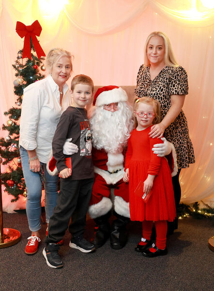  The Nolan family with Santa, at the Down Syndrome Christmas Party in the Tower Hotel. Photo: Joe Evans
