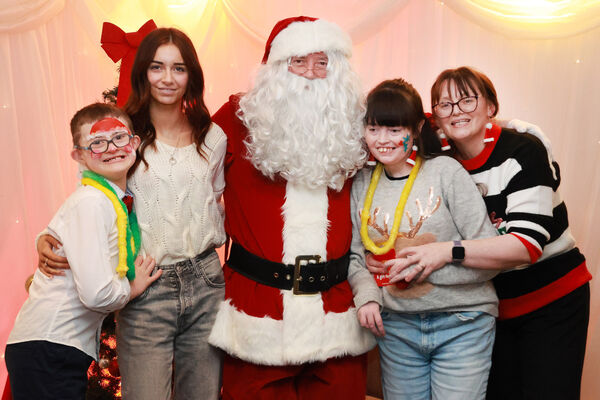  The Felle family with Santa, at the Down Syndrome Christmas Party in the Tower Hotel. Photo: Joe Evans