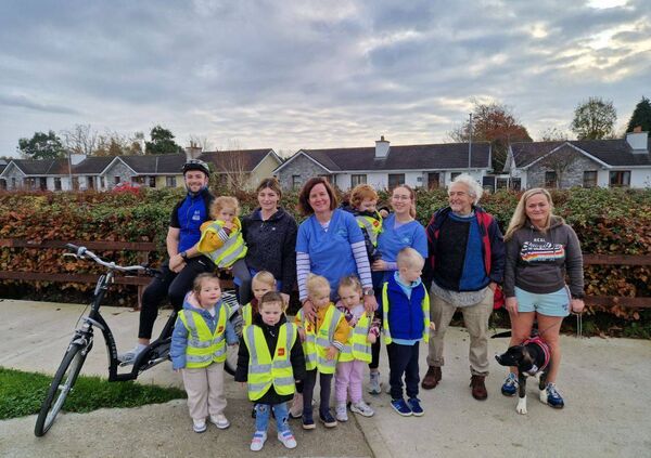 Sesame Early Years Specialist Day Service children and staff members Melissa, Kitti and Dearbhla with Ray McGrath (Waterford Older People’s Council chairperson), Thomas Shaw Hamilton (Waterford Sports Partnership) and Susan Whelan and her new puppy.