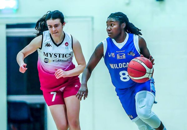 Wildcats Ashia McCalla gets away from Mystic's Caoimhe O'Sullivan