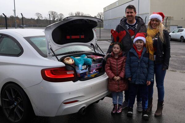 Evan, Jacinta, Charlie and Ellie from Patrickswell in Co. Limerick, bringing toys from 'Impact Labelling' in Limerick