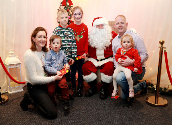  The Aylward family with Santa, at the Down Syndrome Christmas Party in the Tower Hotel. Photo: Joe Evans