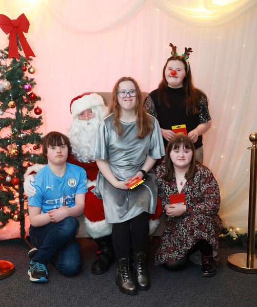  Charlie, Lily, Brooke and Lauren with Santa, at the Down Syndrome Christmas Party in the Tower Hotel. Photo: Joe Evans