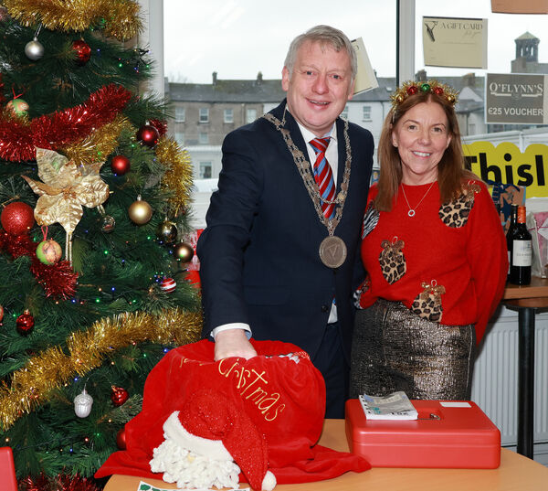  Mayor of Waterford City &amp; County Cllr Jason Murphy and Principal Noreen Reilly, make the draw for the Christmas raffel at the WCFE Christmas Fair 2024 beneficiariesare The Women's Centre and Helping Hands, with over €1, 200 raised at the event in WCFE. Photo: Joe Evans
