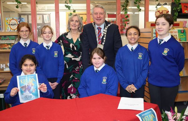 Autor, Dolores Lyons and Mayor of Waterford City &amp; County Cllr Jason Muirphy with, pupils form the Presentation Orimary, at the launch of the HSCL Local Education Committee's "One Book One Community” The book chosen is called “Kelda” written by local Author, Dolores Lyons. Photo: Joe Evans