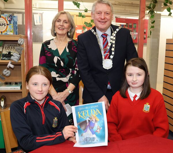 Autor Dolores Lyons and Mayor of Waterford City &amp; County Cllr Jason Murphy with Cara and Ava, St. Ursula's Primary, at the launch of the HSCL Local Education Committee's "One Book One Community” The book chosen is called “Kelda” written by local Author, Dolores Lyons. Photo: Joe Evans