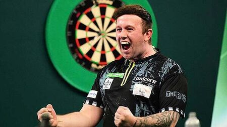 World Darts Championship: Callan Rydz keeps up perfect record to reach last 16
