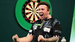 World Darts Championship: Callan Rydz keeps up perfect record to reach last 16
